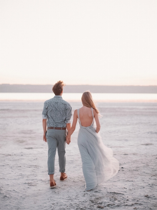 Couple sky water wedding dress