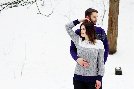 Couple smile snow human body Photo