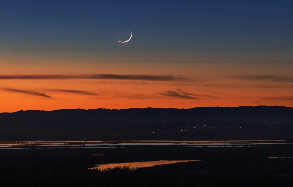 Young moon cloud sky