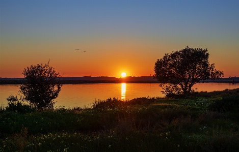 Foto Fiume tramonto cielo acqua