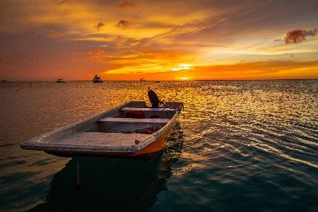 Foto Pôr do sol água nuvem céu