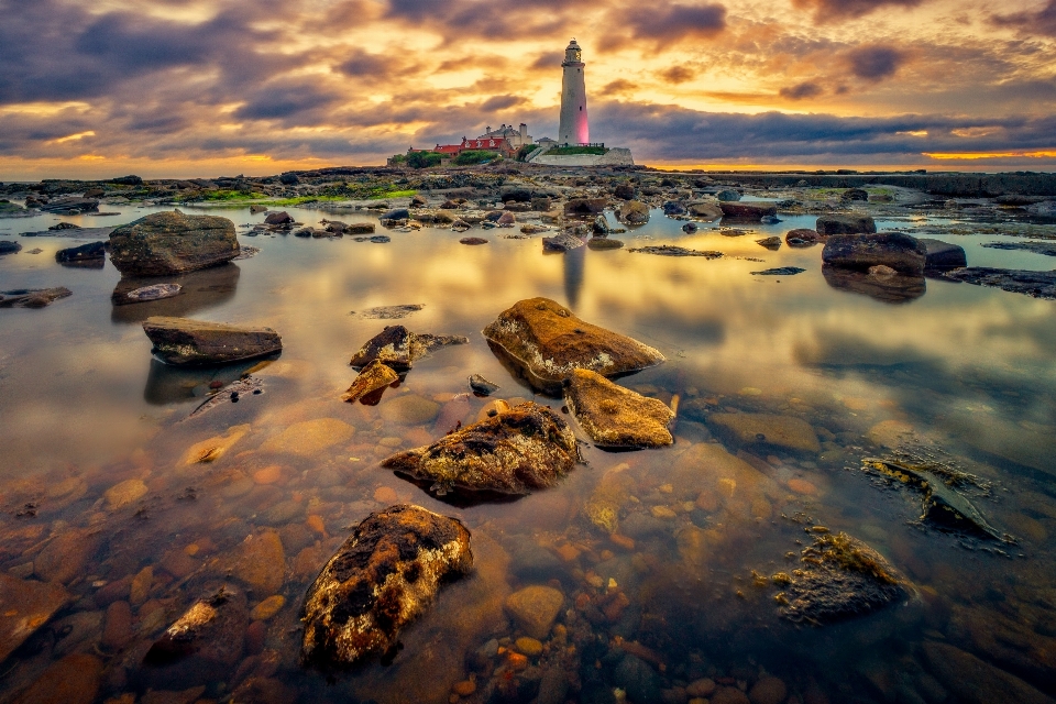 Sun cloud water lighthouse