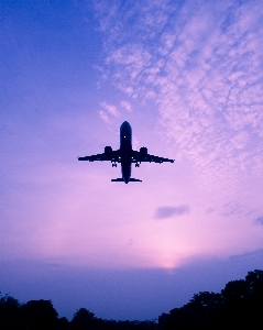 Airplane cloud sky atmosphere Photo