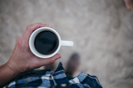 Foto Mano persona caffè bianco