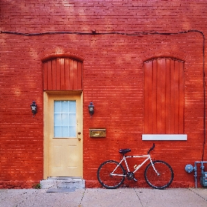 Wood house window bicycle Photo