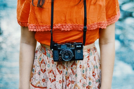 Woman camera photography orange Photo