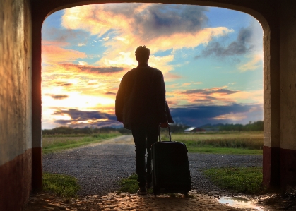 Man walking cloud sunset Photo